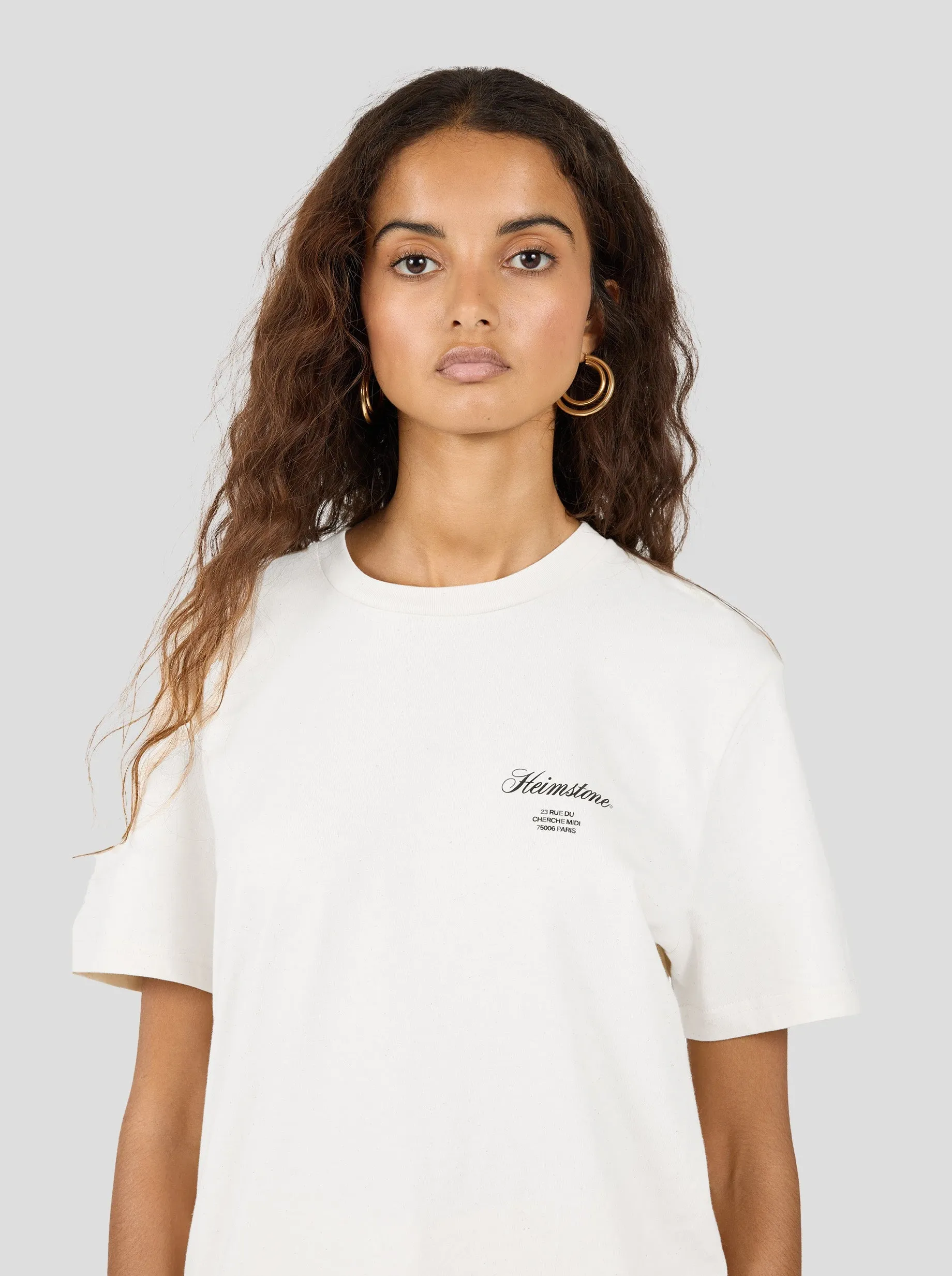 Fashion-Forward Look T-shirt Collector Unisexe ?C Cr??me avec Logo Heimstone Noir